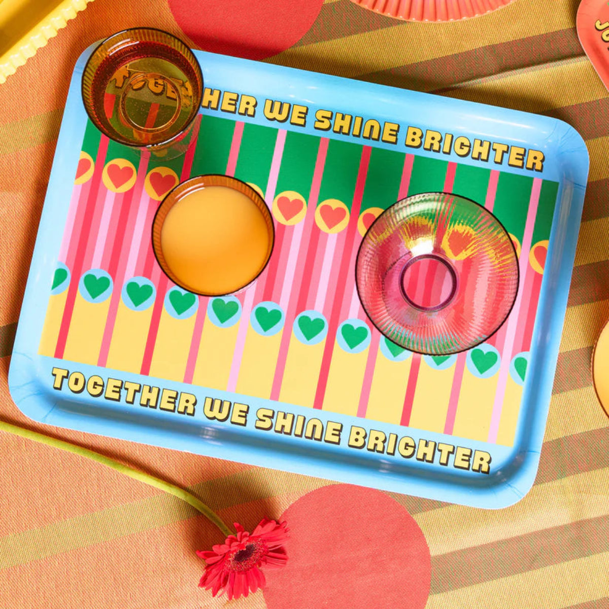 Colourful tray with decorative patterns and text on a patterned background