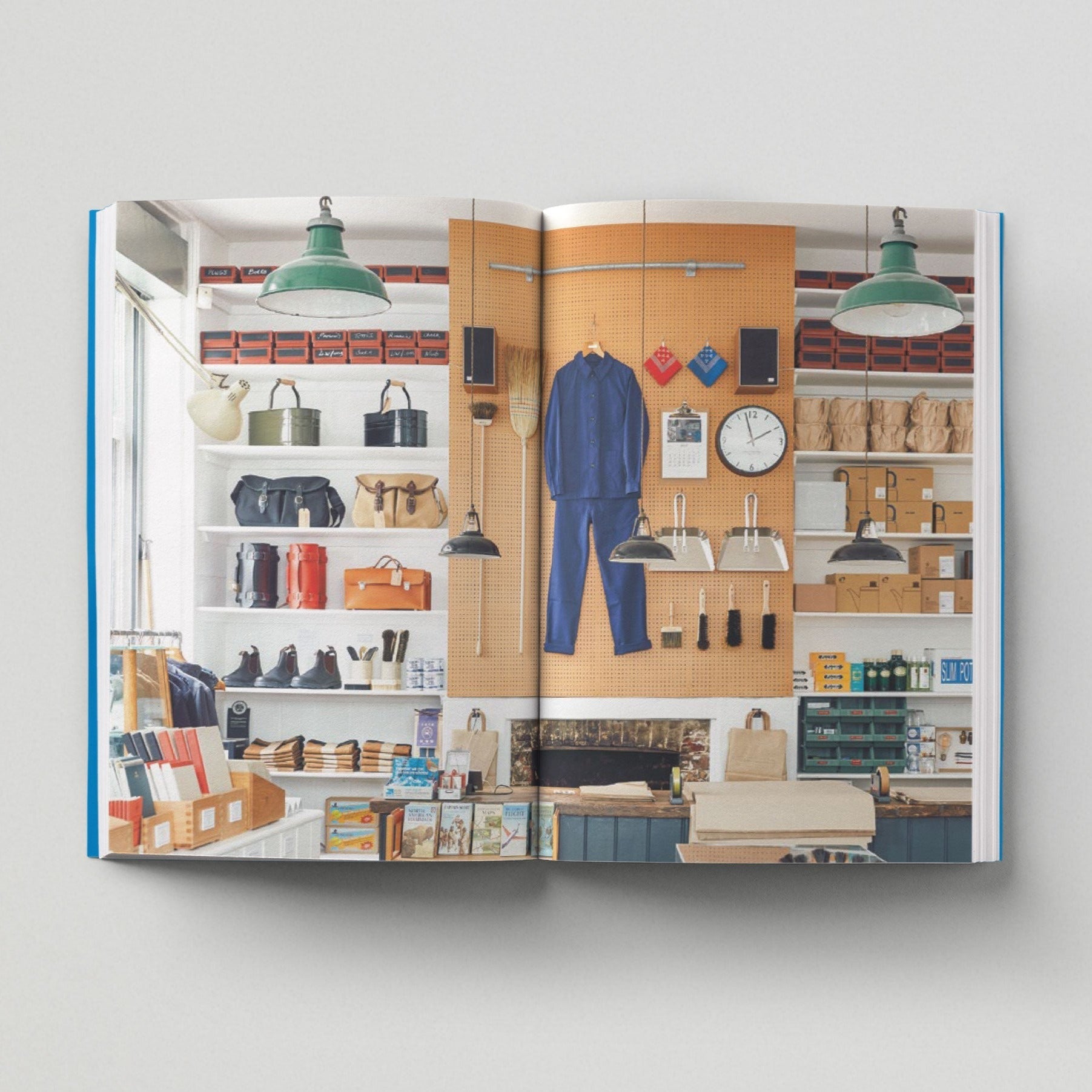 Open page of Independent London book featuring a photograph of a shop interior displaying various colourful items of clothing and bags.