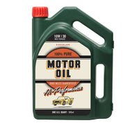 Green motor oil bottle with red cap on a white background