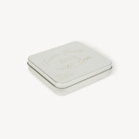 Silver jewelry box with a brand logo on a white background