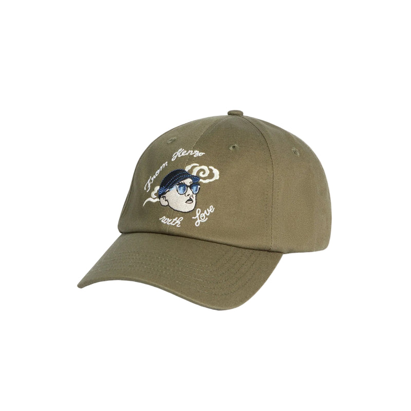 Green cap with embroidered design on a white background