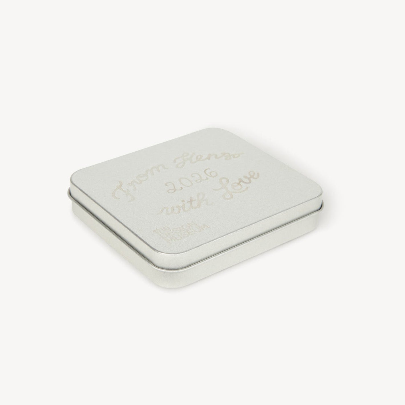 Small rectangular tin with a lid on a white background