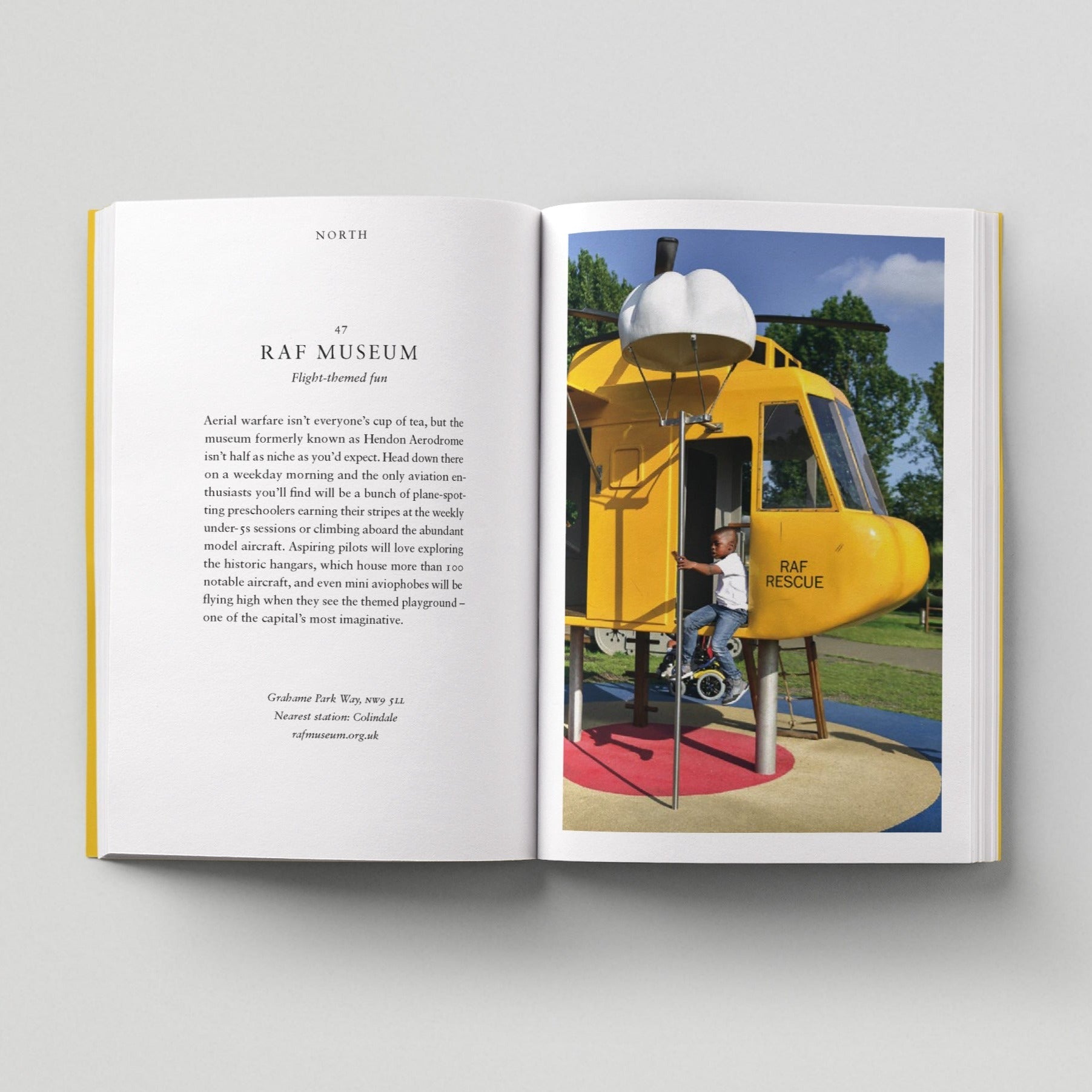 Open page of Kids London book featuring a photograph of a child sitting on a yellow helicopter-shaped playground apparatus.