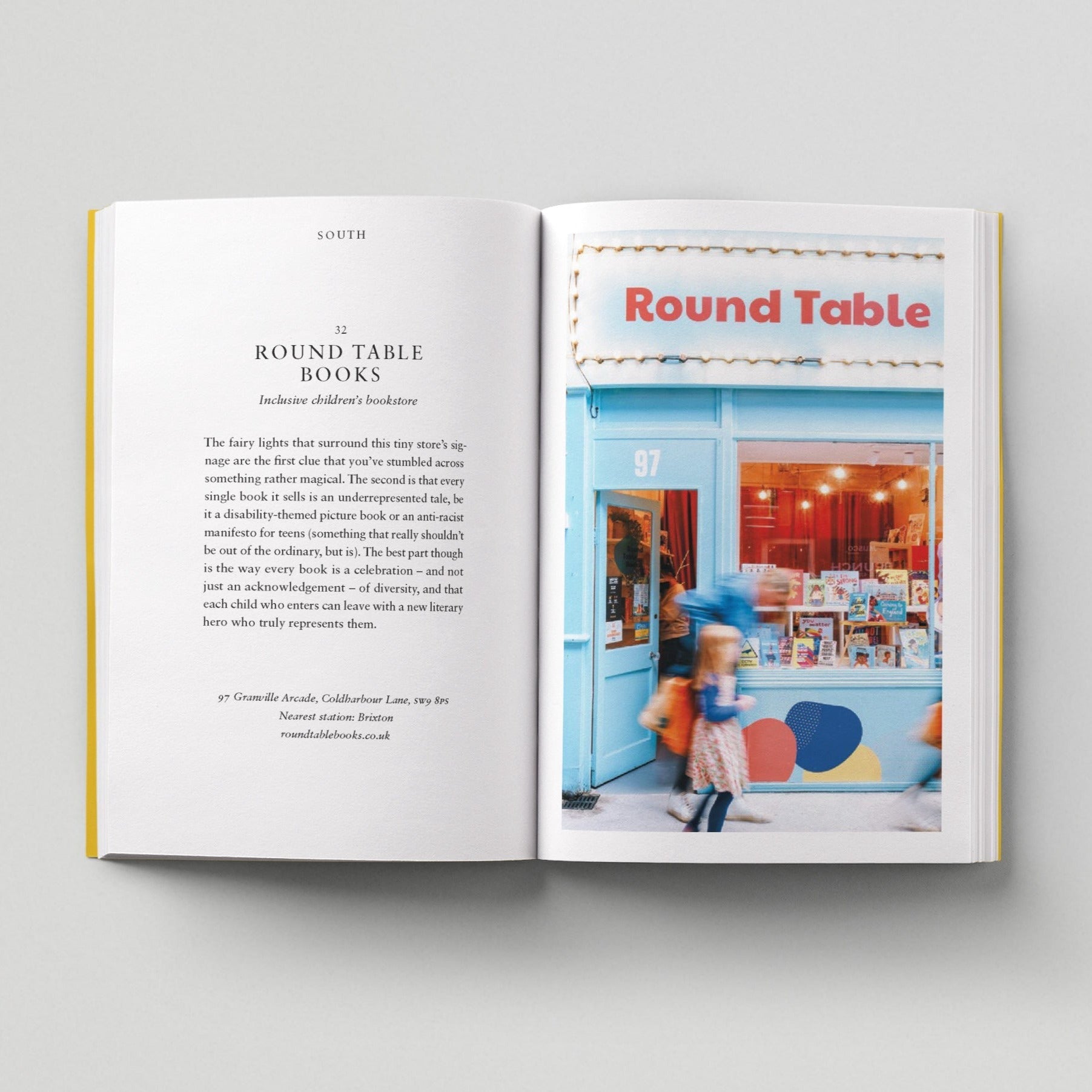 Open page of Kids London book featuring a photograph of the Round Table storefront with blue walls and door.