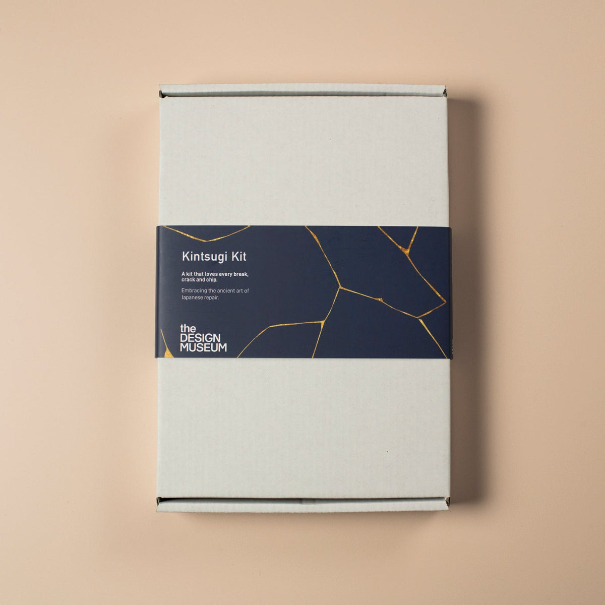 White box with a blue label on a beige background