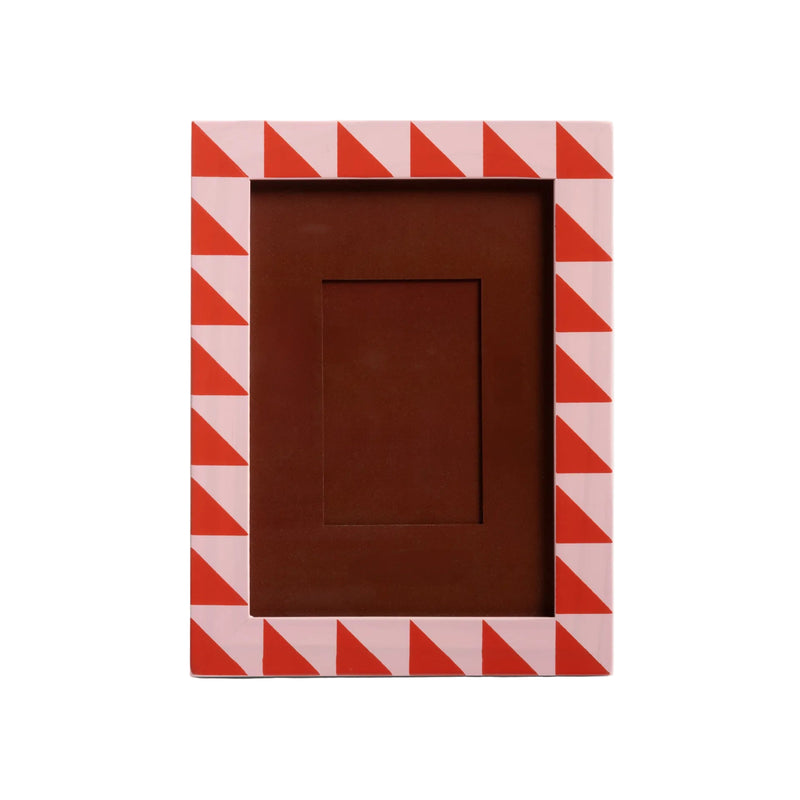 Rectangular photo frame with red and white chevron pattern on a light gray background