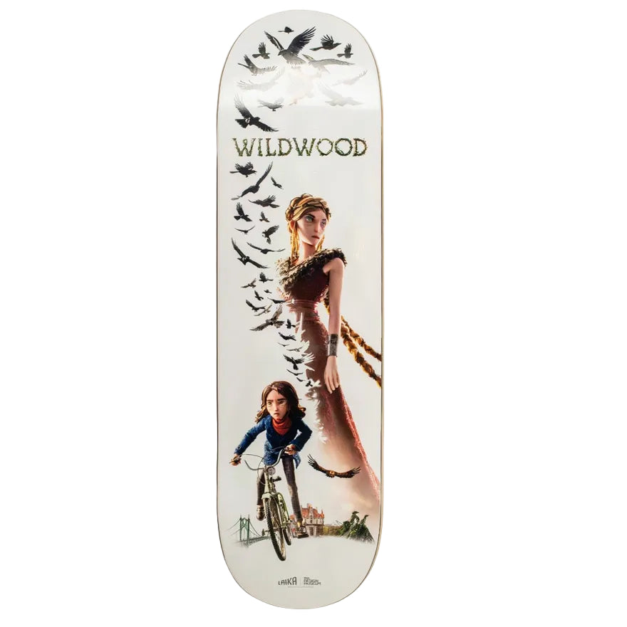 A long skateboard deck with a white base and a detailed graphic print, displayed horizontally against a solid beige background. The graphic features a woman, a child on a bicycle, birds, and the text 'WILDWOOD' and 'windsor rides'.