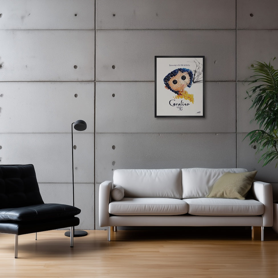 Framed poster of the film Coraline on a grey concrete wall above a white leather sofa