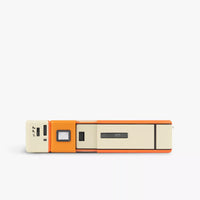 Camera on its side with orange and white components