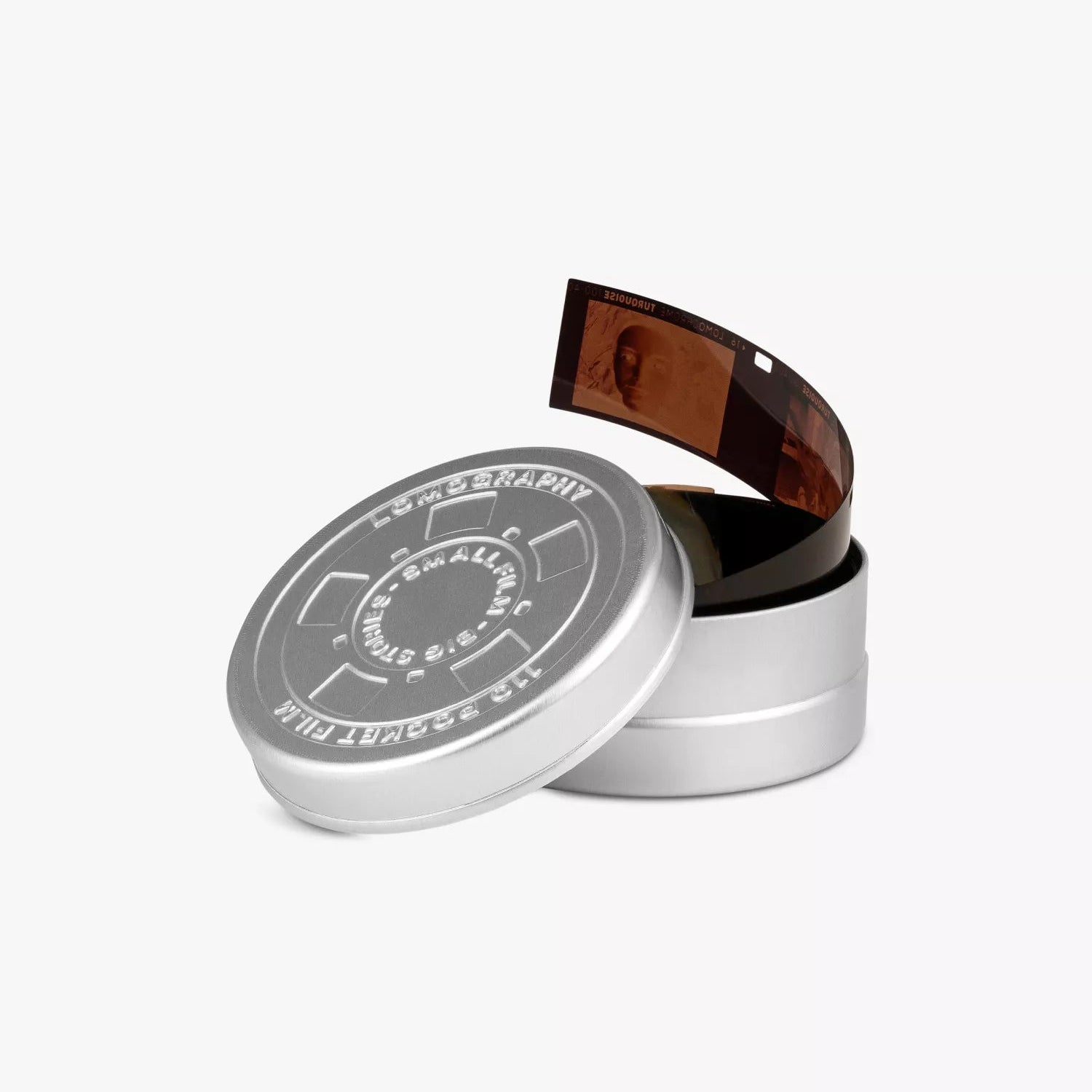 Silver cylindrical container with camera film on a white background