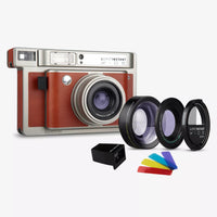 Vintage-style camera with lens filters and colorful filters on a white background