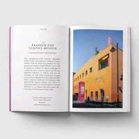 Open page of London Museums book featuring a photograph of the outside of the Fashion and Textile Museum.