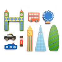 A collection of colourful wooden toy blocks in the shape of iconic London landmarks and vehicles, such as a double-decker bus, tower, and cars.