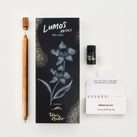 Lumos Metals Pro Duo packaging with a pen and other items on a white background