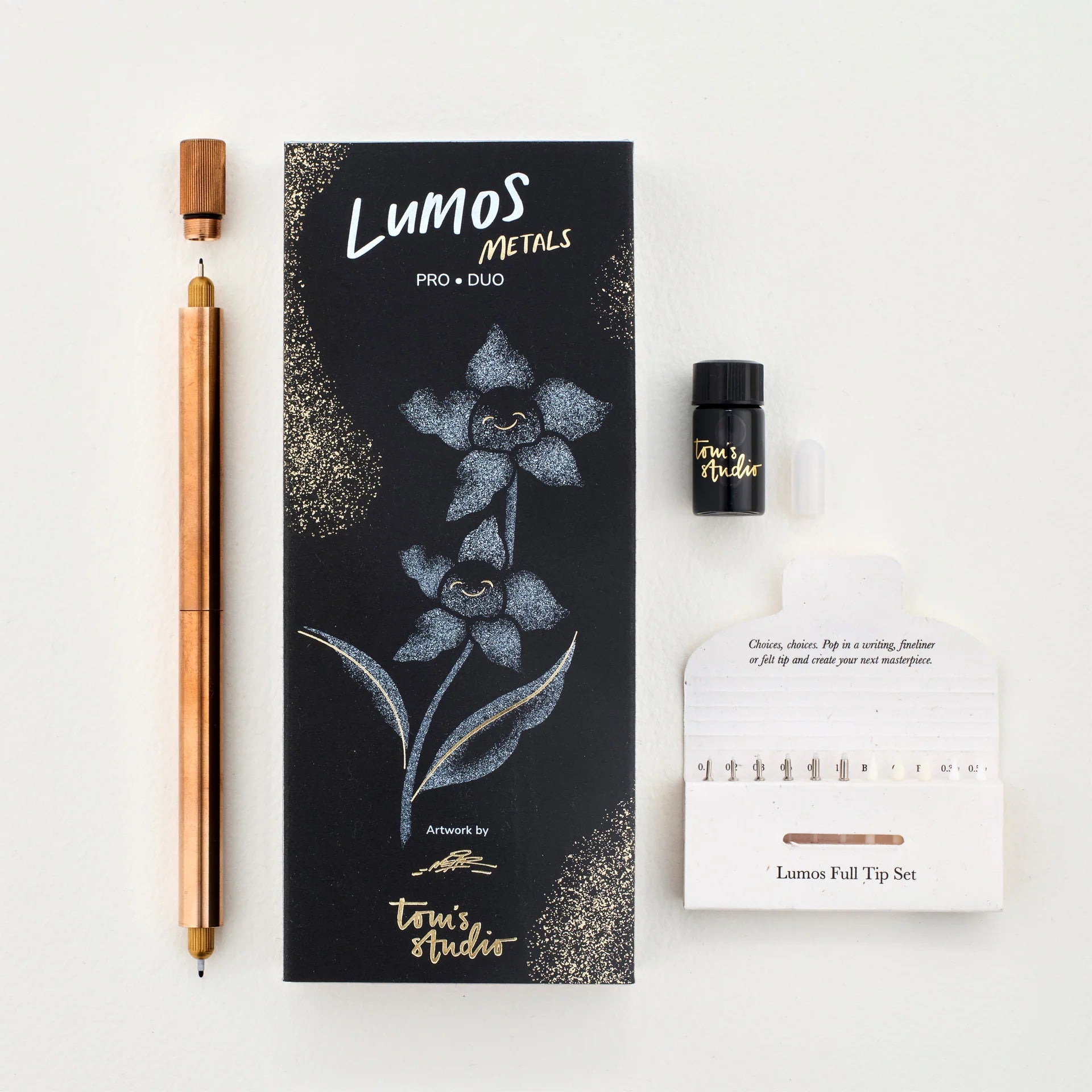 Lumos Metals Pro Duo packaging with a pen and other items on a white background