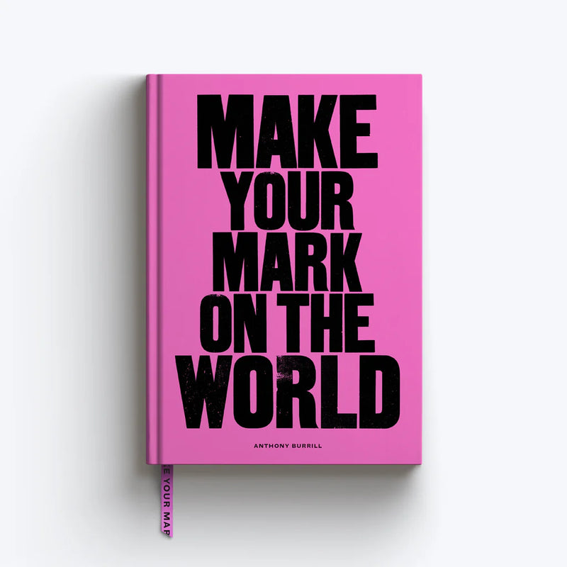A pink notebook with the text 'Make Your Mark on the World' by Anthony Burrill in bold black lettering.