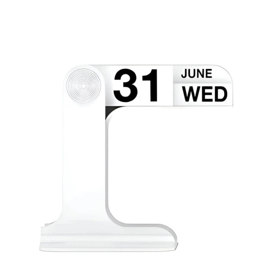 A modern minimalist desktop calendar stand made of clear acrylic, displaying the date '31 JUNE WED' in bold black text on a white panel, set against a solid white background.