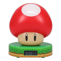 Red mushroom-shaped alarm clock with a digital display on a white background