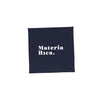 Navy blue square with 'Materia Rica.' text on a white background