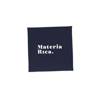 Navy blue square box with 'Materia Rica.' text in white on a white background