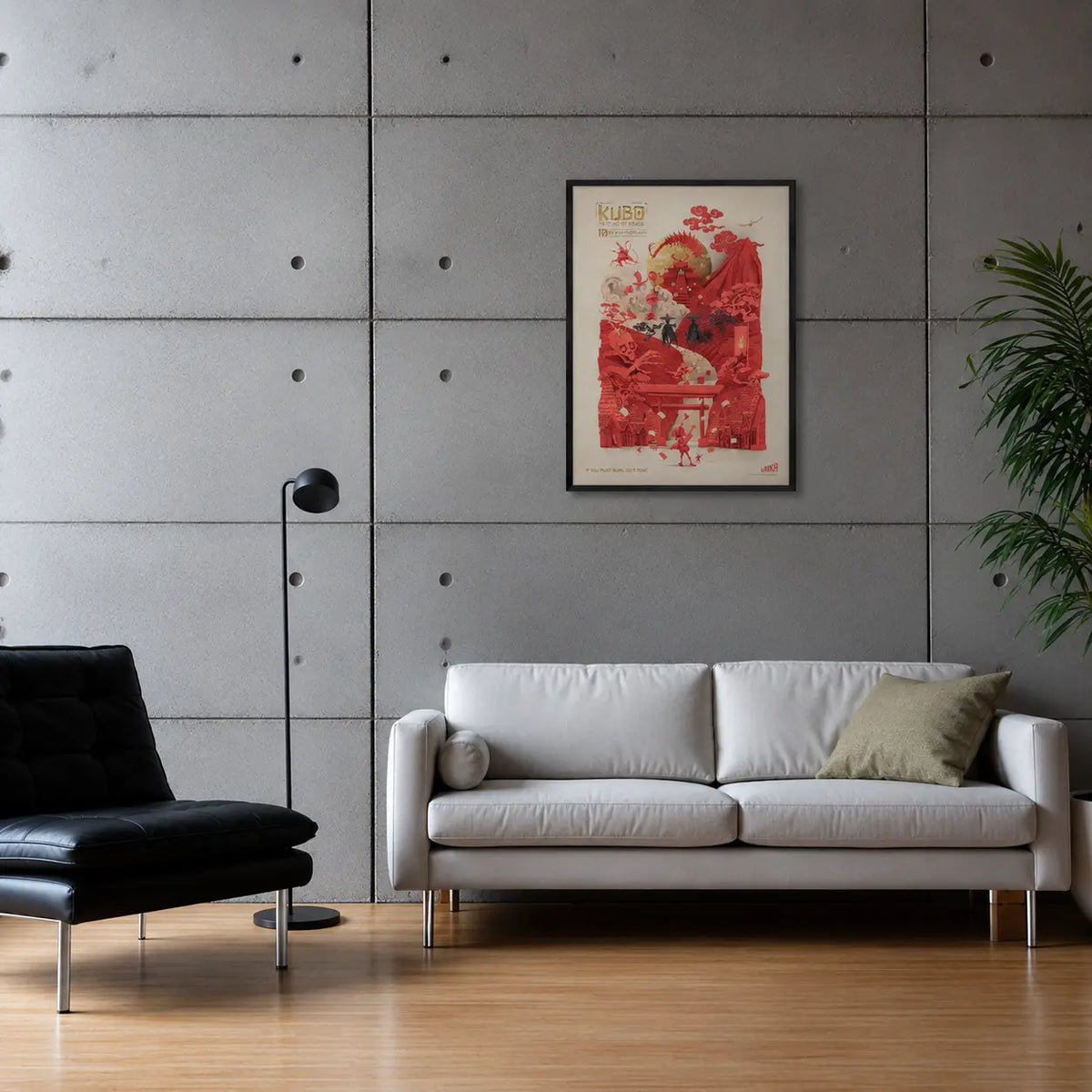 Framed poster of the film Kubo on a grey concrete wall above a white leather sofa