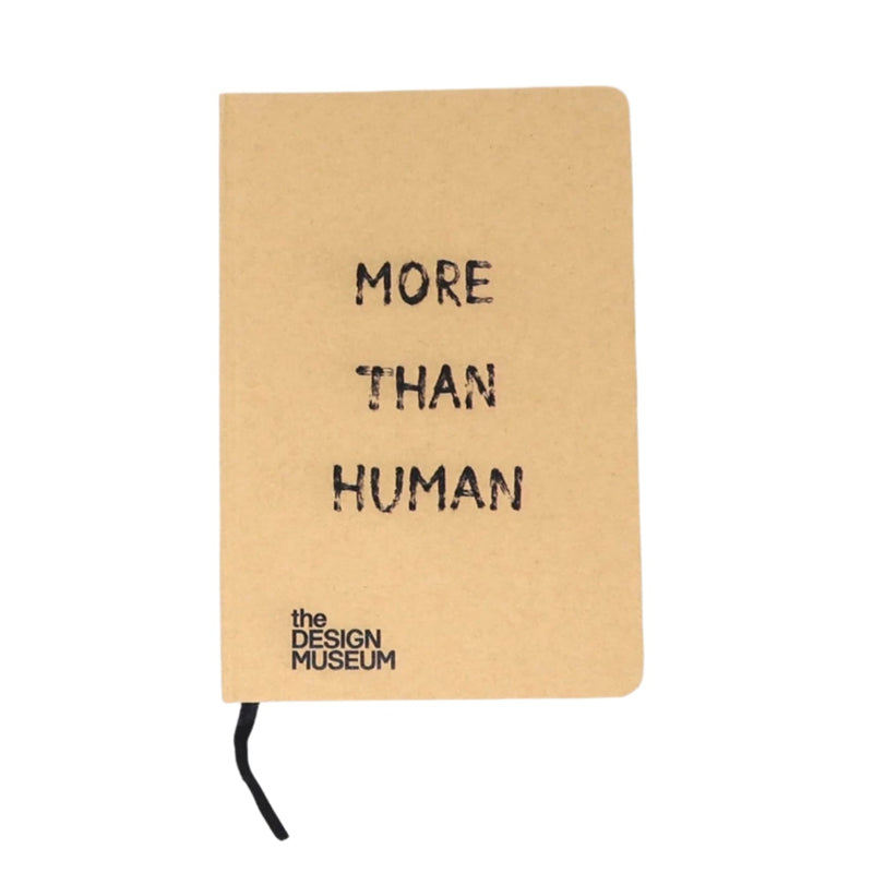 A light brown notebook with 'More Than Human' text and Design Museum logo on a white background