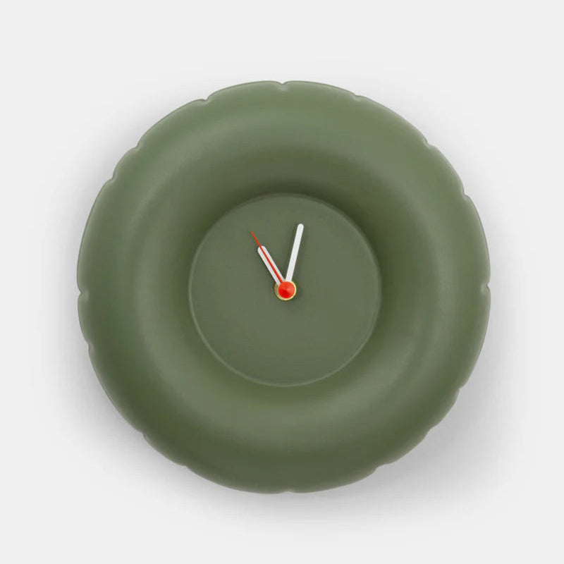 A round green minimalist designed clock