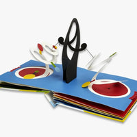 The inside of Move! Pop-Up book featuring a blue page with black and white pop-up elements.