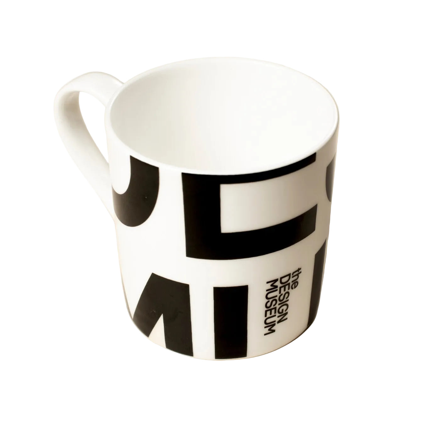 A white ceramic mug with bold black graphic lettering, featuring the text 'DESIGN MUSEUM' vertically, set against a solid beige background.