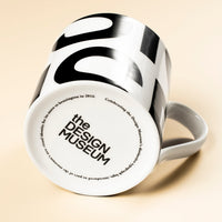 White mug with black writing on its base