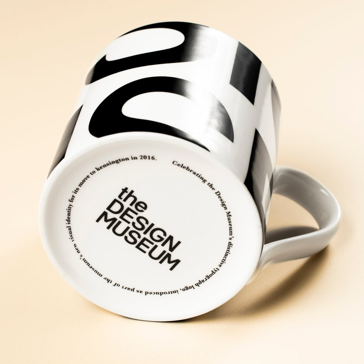 White mug with black writing on its base