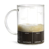 Clear glass mug with coffee measurement markings on a white background