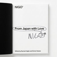 An open book or booklet showing a white interior page with the title 'From Japan with Love' and 'NIGO' printed in black, alongside a black cover edge on the left, photographed against a light gray background.