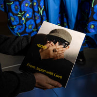 Person holding a catalogue