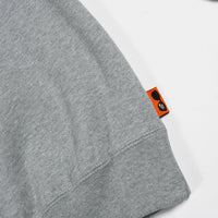 Gray sweatshirt with a brand tag on a white background
