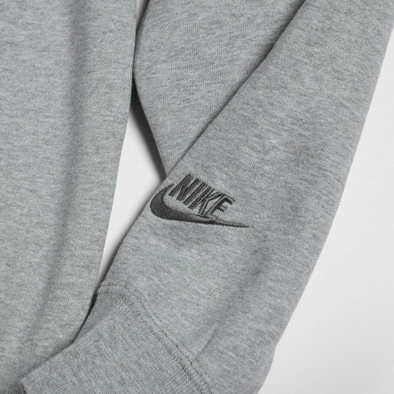 Gray Nike sweatshirt with logo on a light gray background