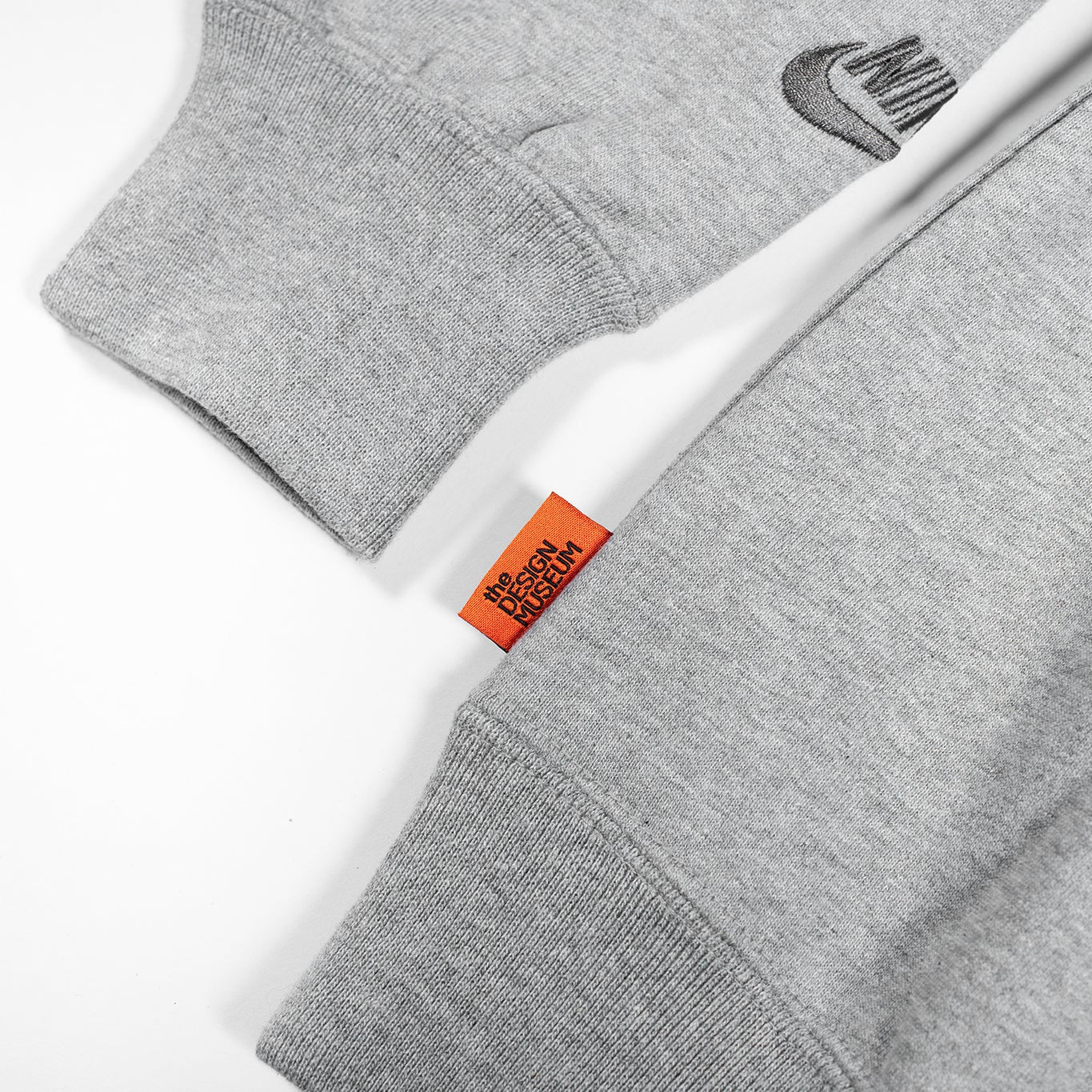 Gray sweatshirt with a brand logo on a white background
