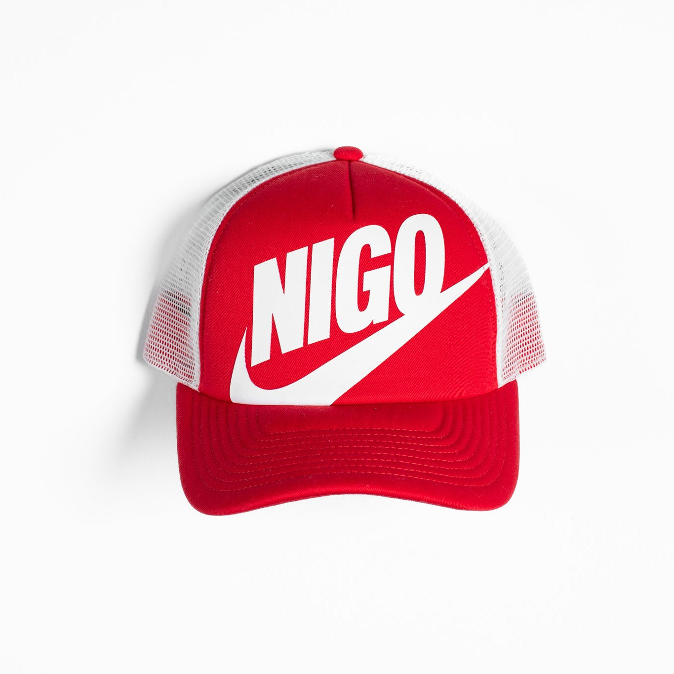 Red cap with 'NIGO' logo on a white background