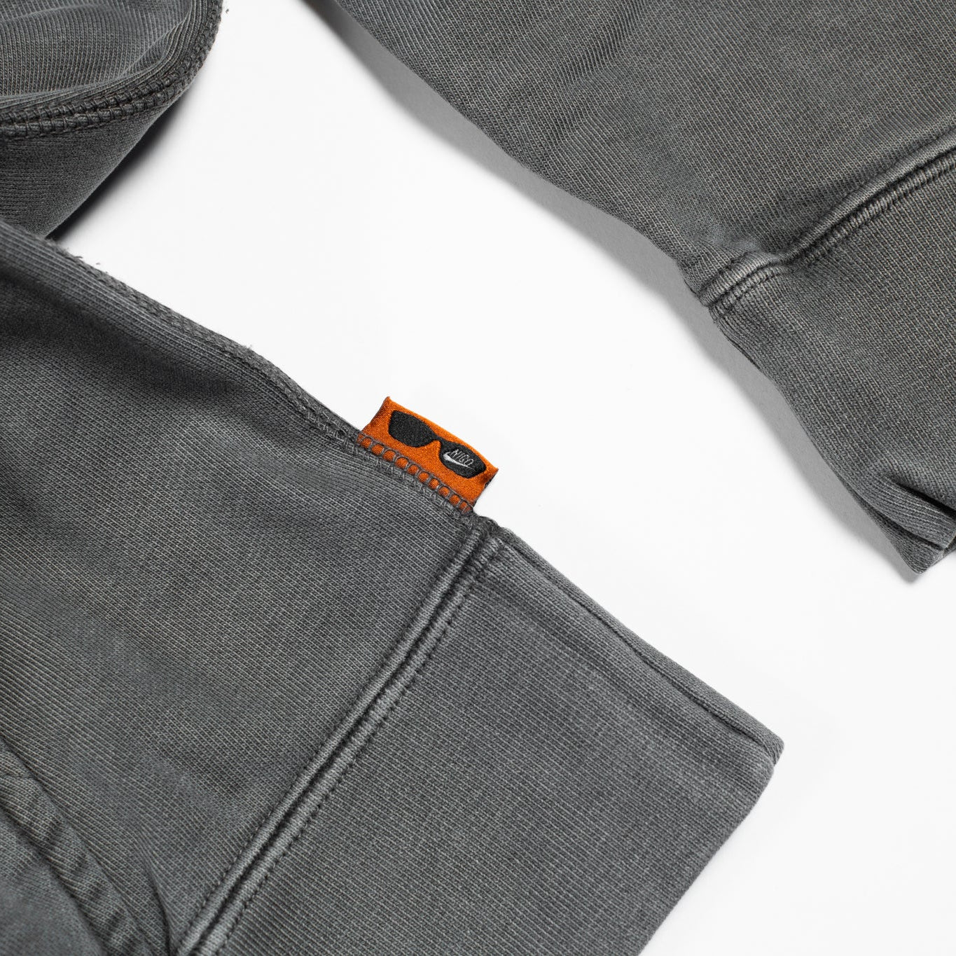 Gray sweatshirt with a brand logo on a white background