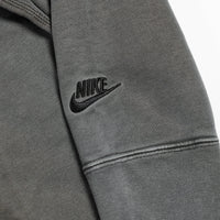 Gray Nike jacket with logo on a light gray background