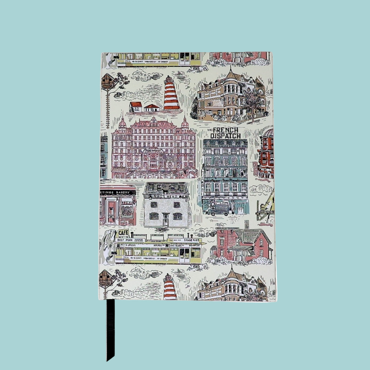 Notebook with a colorful cityscape design on the cover against a white background