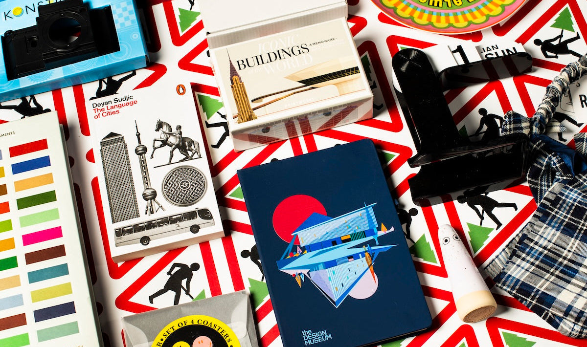 Collection of vintage toys and books on a red, white, and blue patterned surface