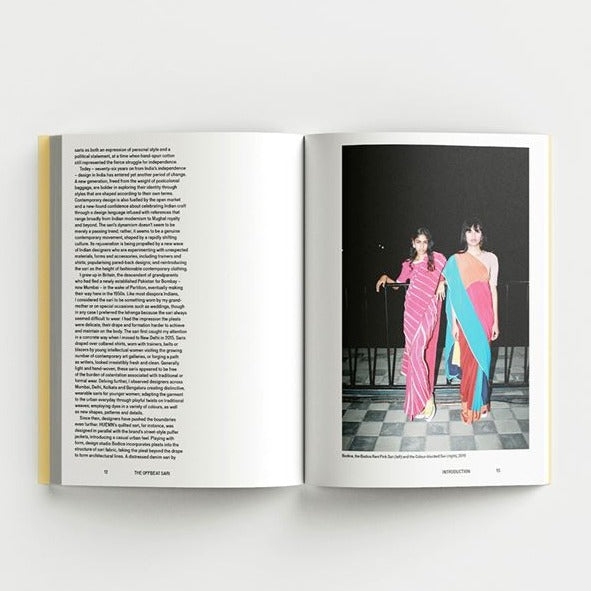 Inside page of the Offbeat Sari catalogue with a photograph of two people wearing saris.