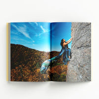 Inside page of the Offbeat Sari catalogue with a photograph of a person rock climbing wearing a sari.
