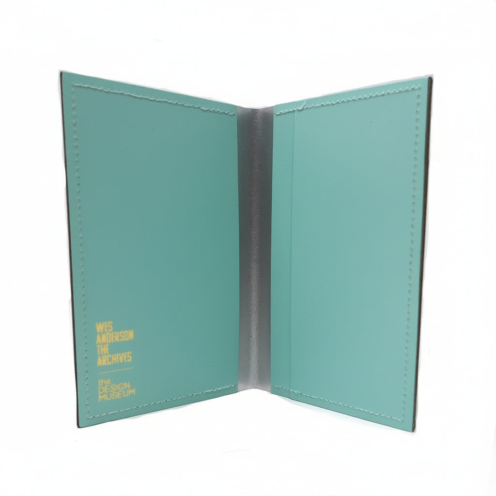 Teal passport holder with visible branding on a white background
