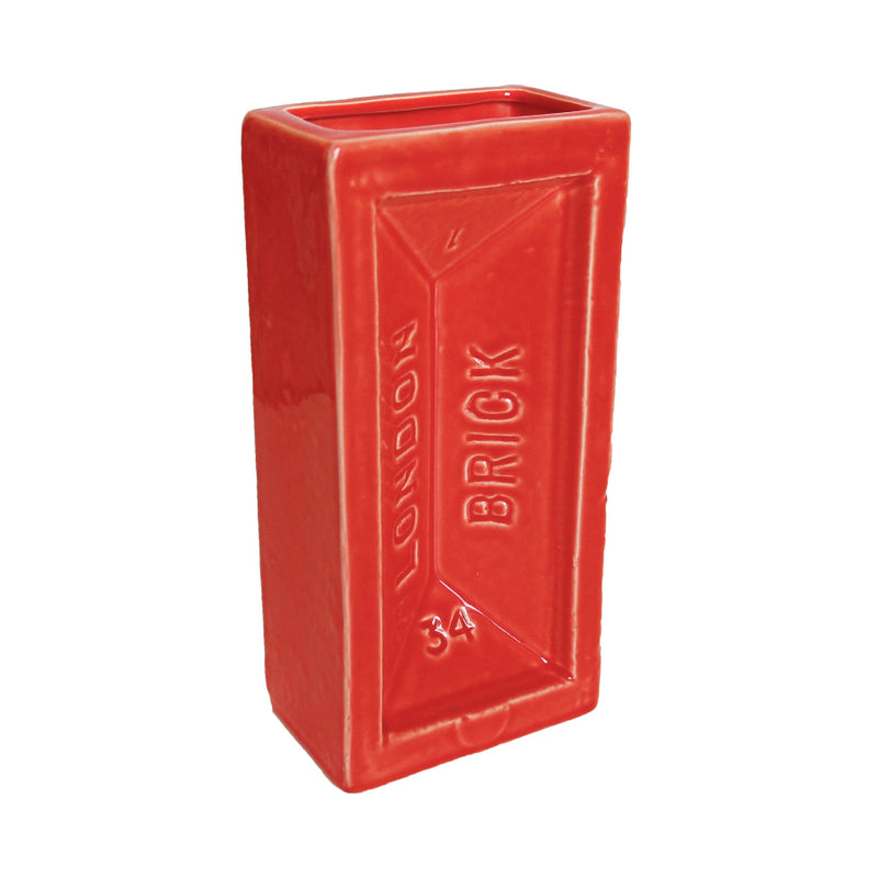 A red ceramic brick-shaped vase with the words 'LONDON BRICK' printed on the side.
