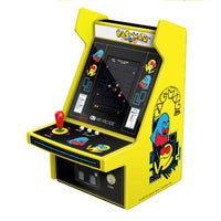 Miniature Pac-Man arcade machine with yellow casing on a white background