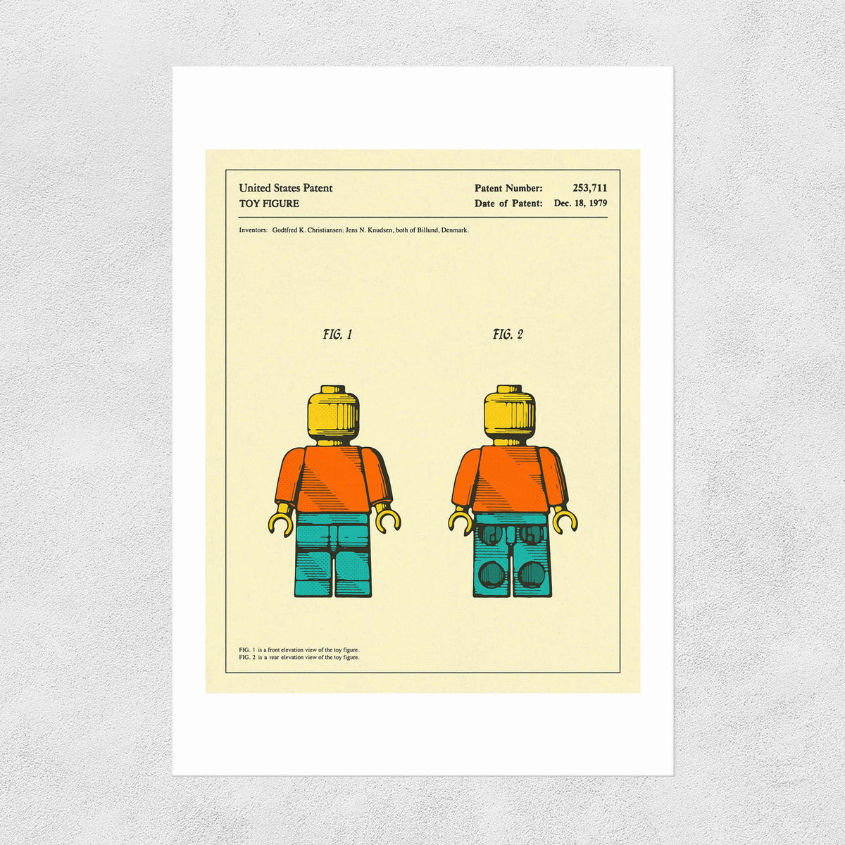 A printed Lego patent from 1979 featuring two Lego figurines on a yellow background.