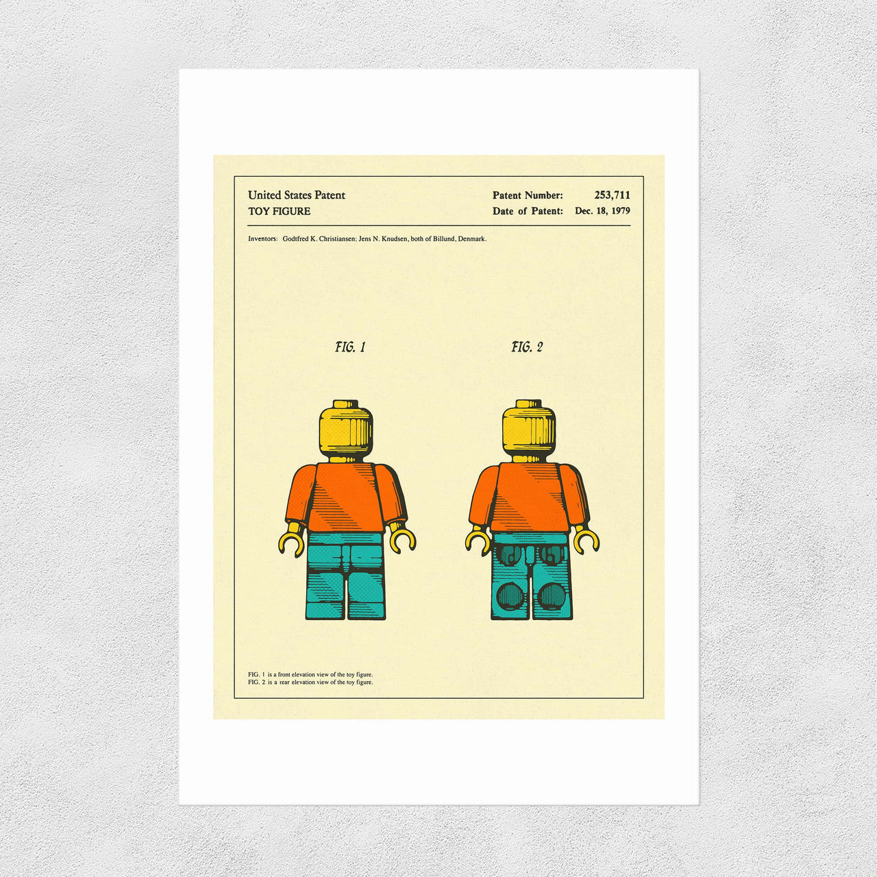 A printed Lego patent from 1979 featuring two Lego figurines on a yellow background.