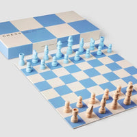 blue and white chess set on a white background